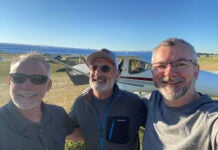 Marc Cook, Tom Hamilton, and Omar Filipovic at AirVenture 2022. Tom Hamilton is the designer of the GlaStar experimental, seen in the background.