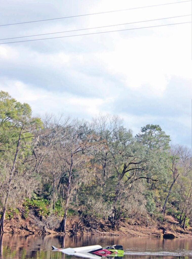 The Buccaneer struck the power lines while searching for a lost life vest on the river. Dusk and cloud cover likely made the lines difficult to see. (Photo: National Transportation Safety Board)