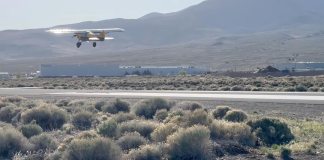 Paul Dye takes off in the NX Cub from his home field in Nevada.