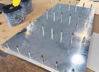 Clecos in an airplane panel illustrating the many repetitive task