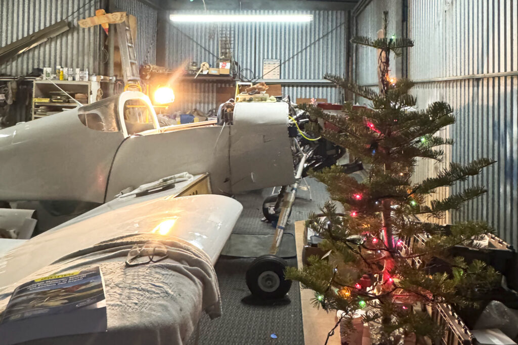 Festive vibes at hangar 32, with N2165U and her Christmas tree.