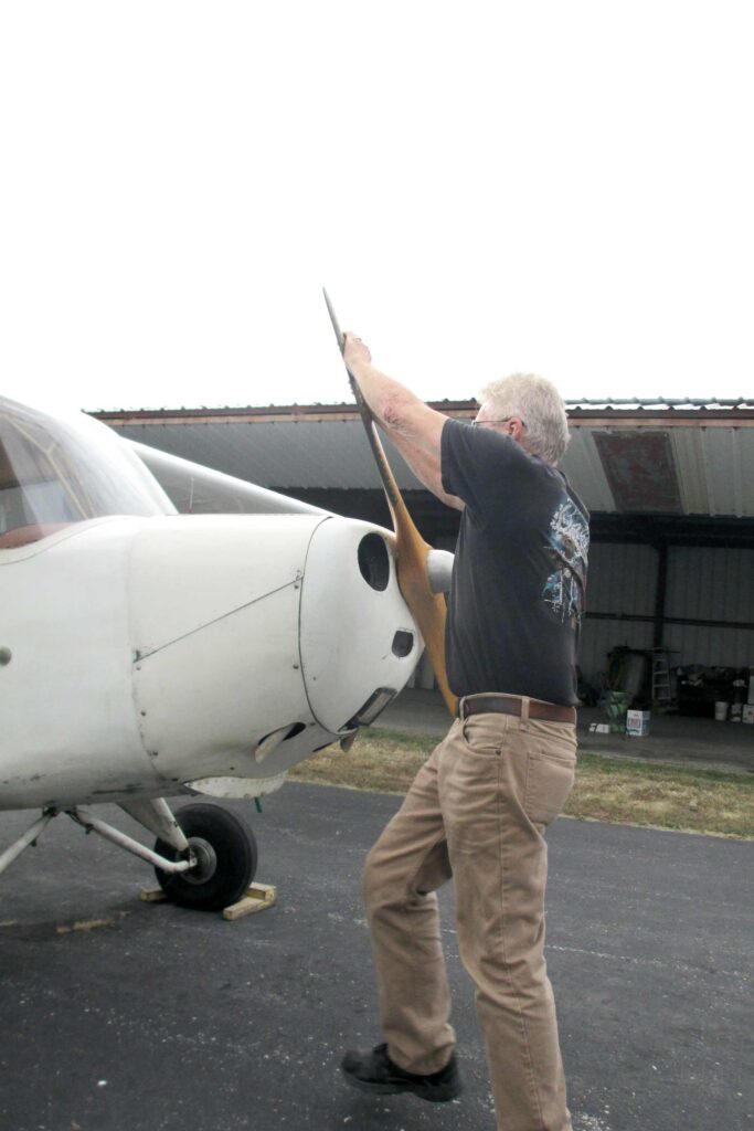 The 1946 Aeronca Champ's tailwheel design offers a better propping standpoint than more modern tricycle-gear airplanes.